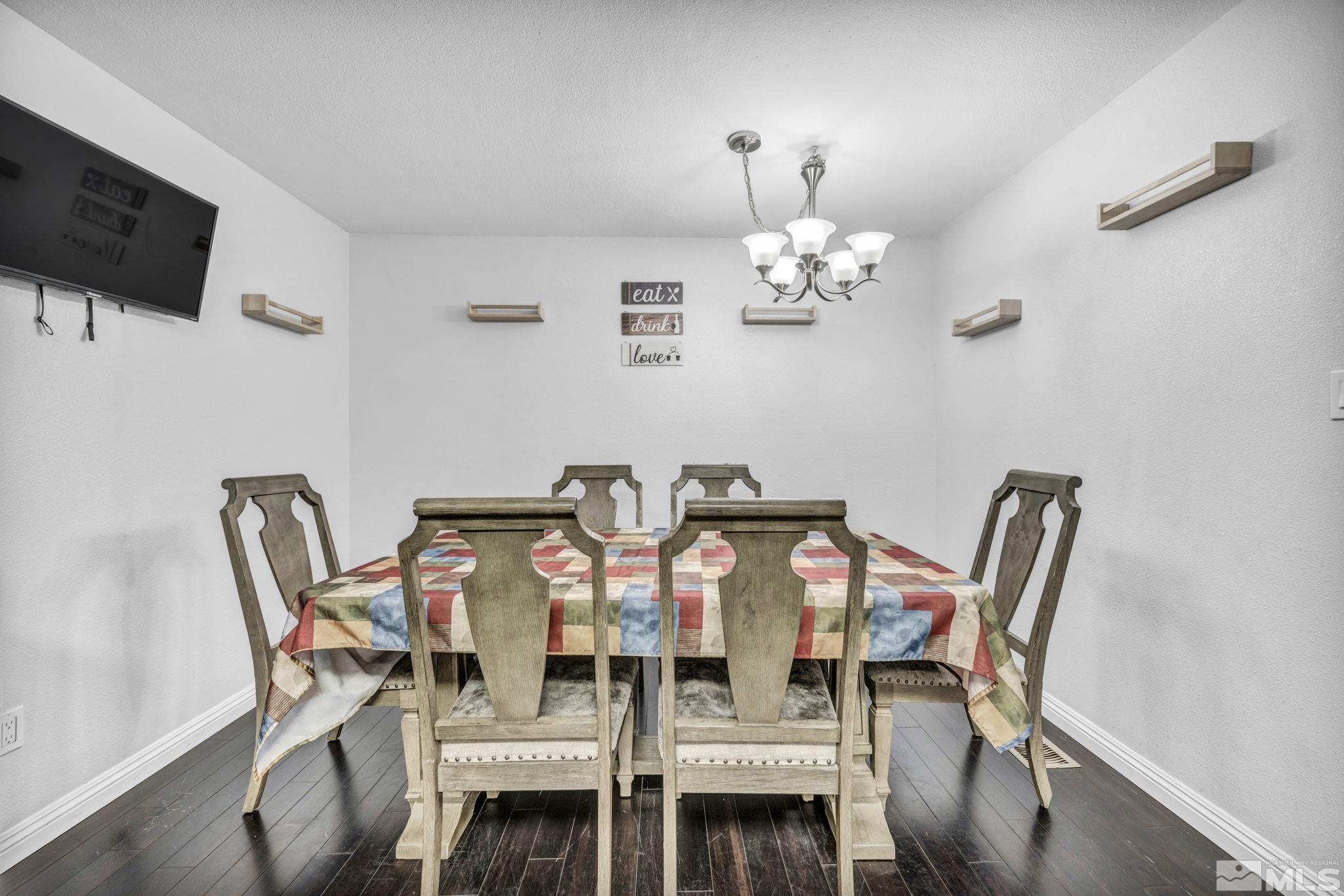 6805 Peppermint Drive Reno, NV 89506 - Photo 11 of 26 a view of a dining room with furniture and wooden floor