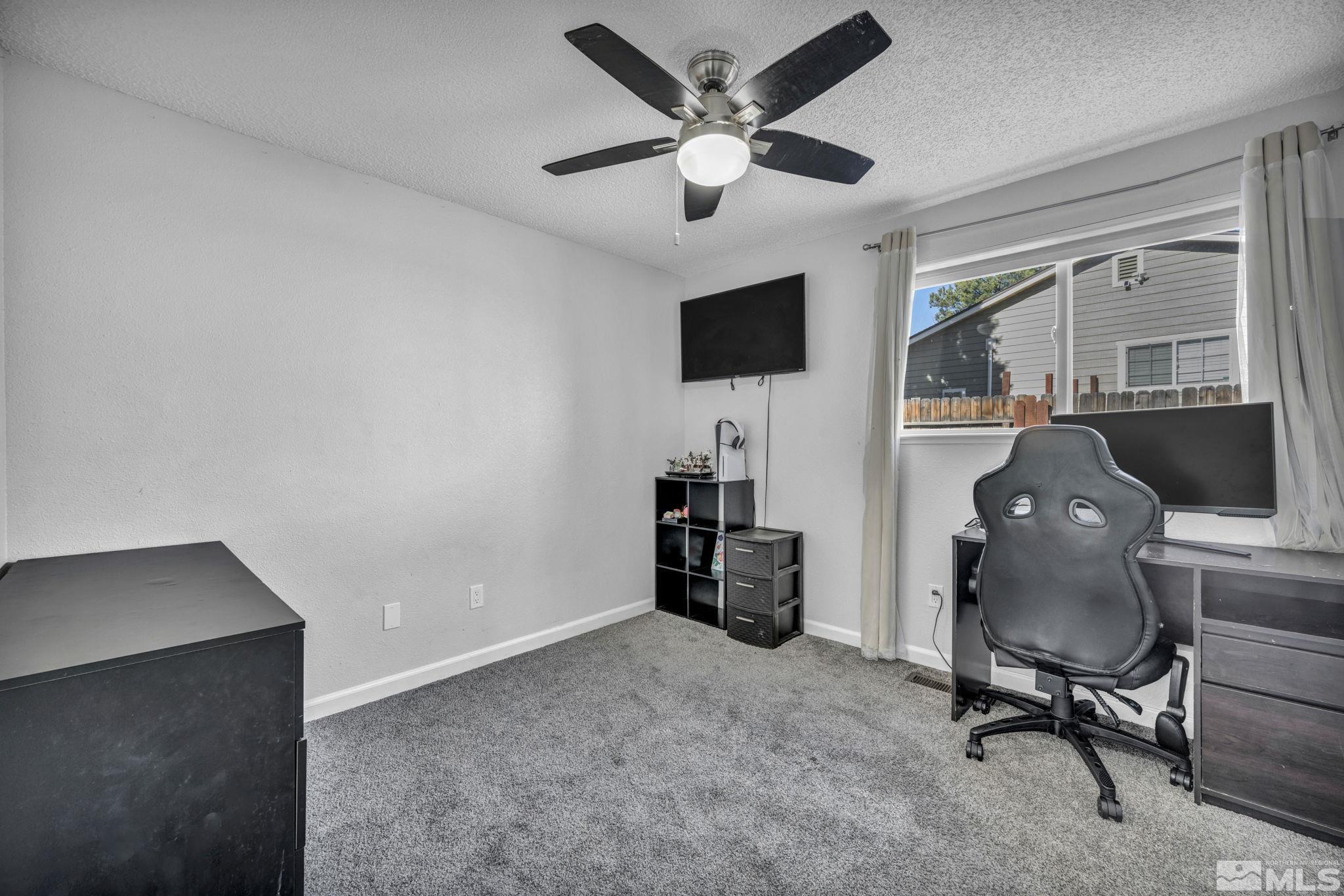 6805 Peppermint Drive Reno, NV 89506 - Photo 13 of 26 a livingroom with workspace and a window