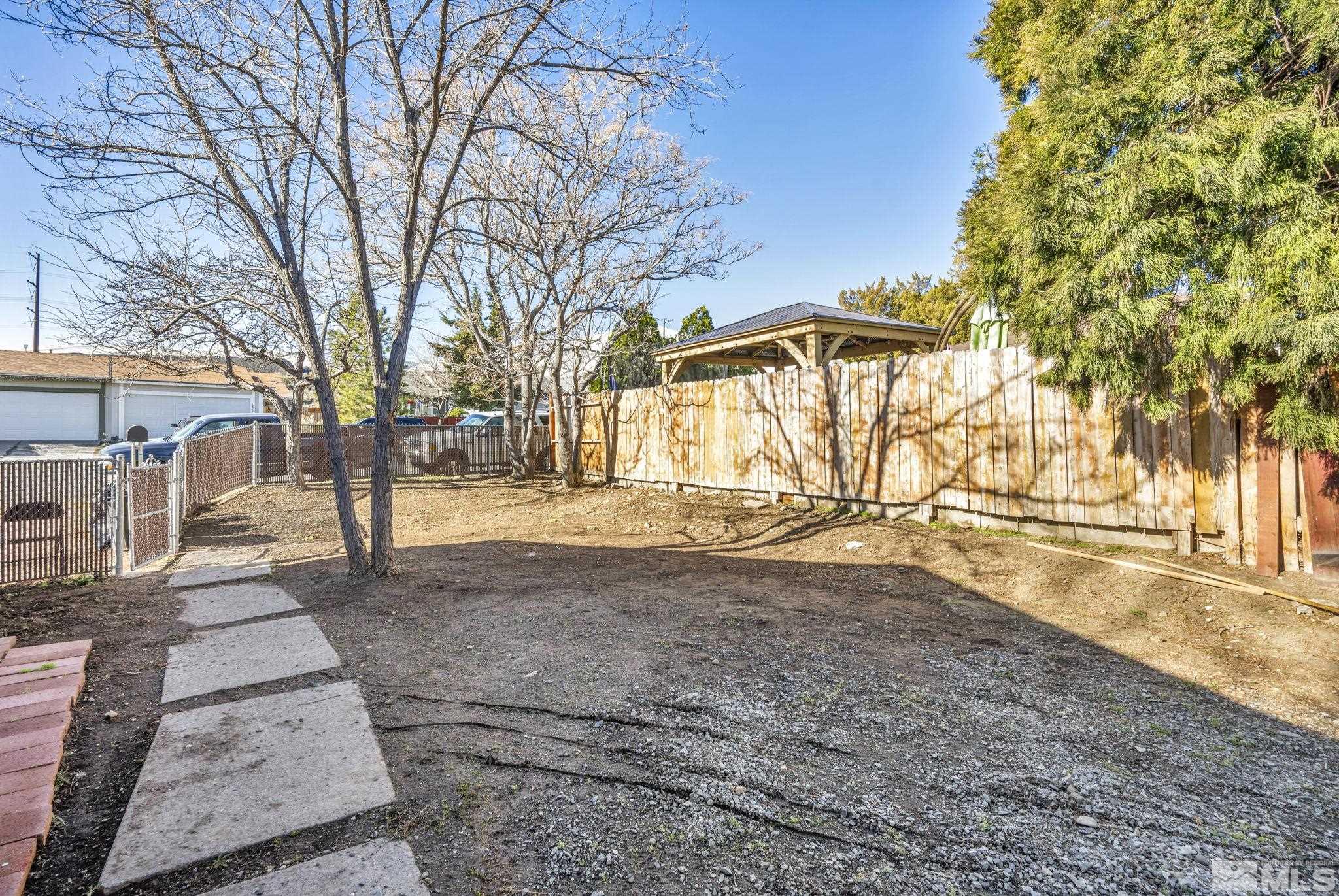 6805 Peppermint Drive Reno, NV 89506 - Photo 23 of 26 a view of yard covered with snow in front of house