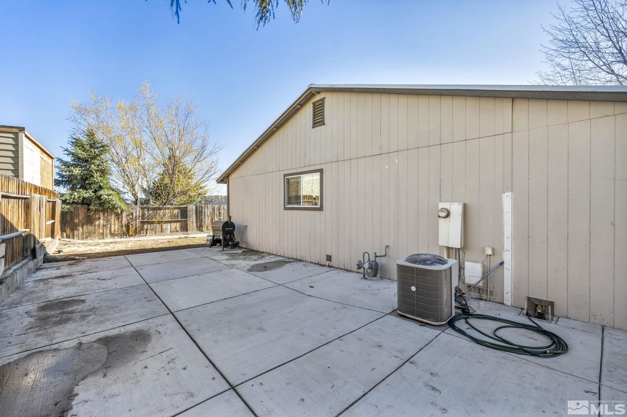6805 Peppermint Drive Reno, NV 89506 - Photo 25 of 26 a view of backyard with wheel chair and potted plants
