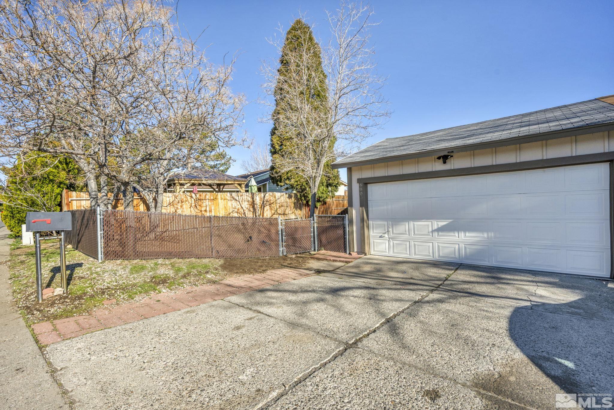 6805 Peppermint Drive Reno, NV 89506 - Photo 26 of 26 a view of a house with a yard