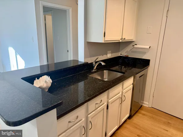 a kitchen with a sink and cabinets