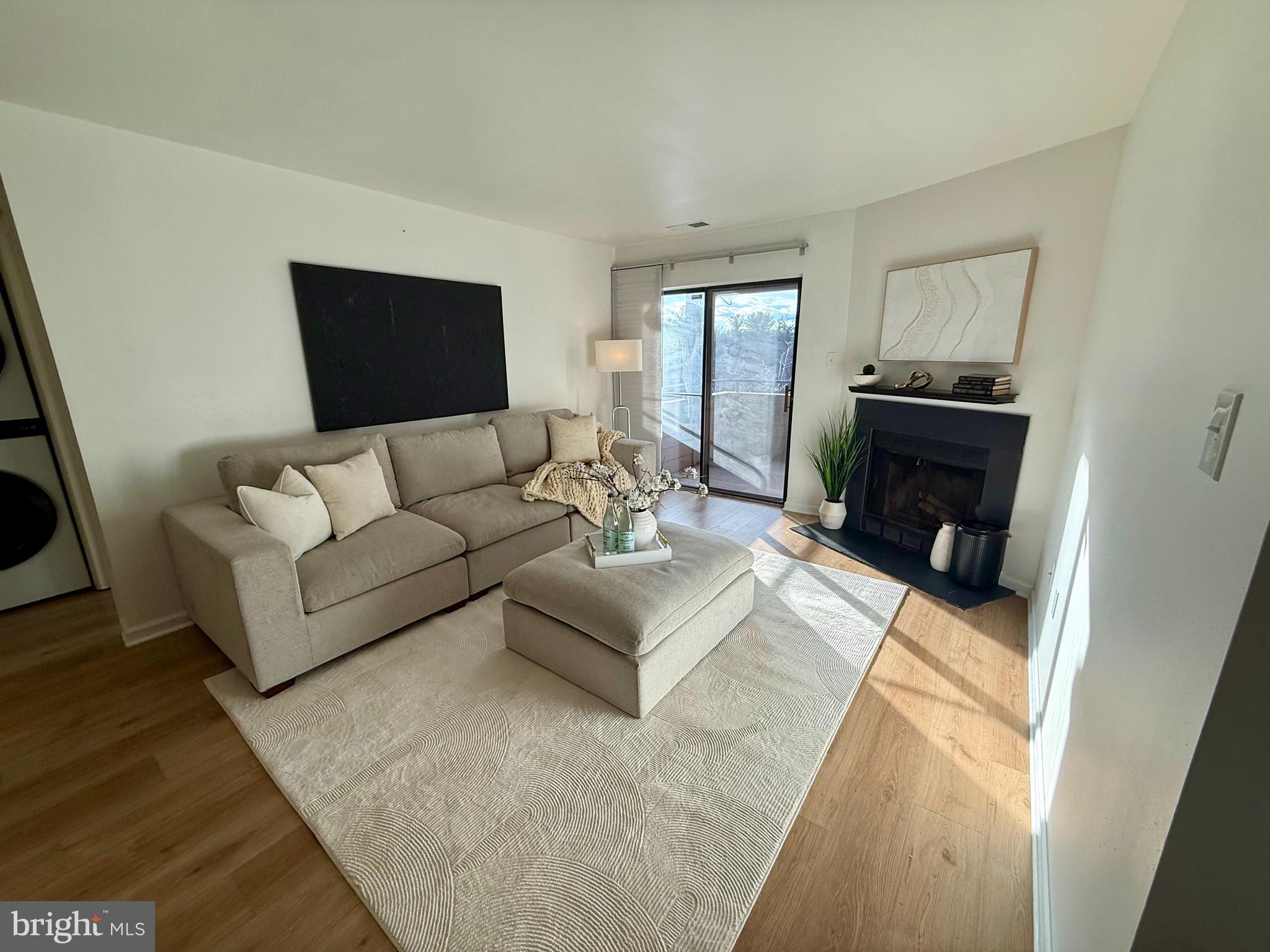5355 Smooth Meadow Way, Unit 5 Columbia, MD 21044 - Photo 13 of 26 a living room with furniture and a fireplace
