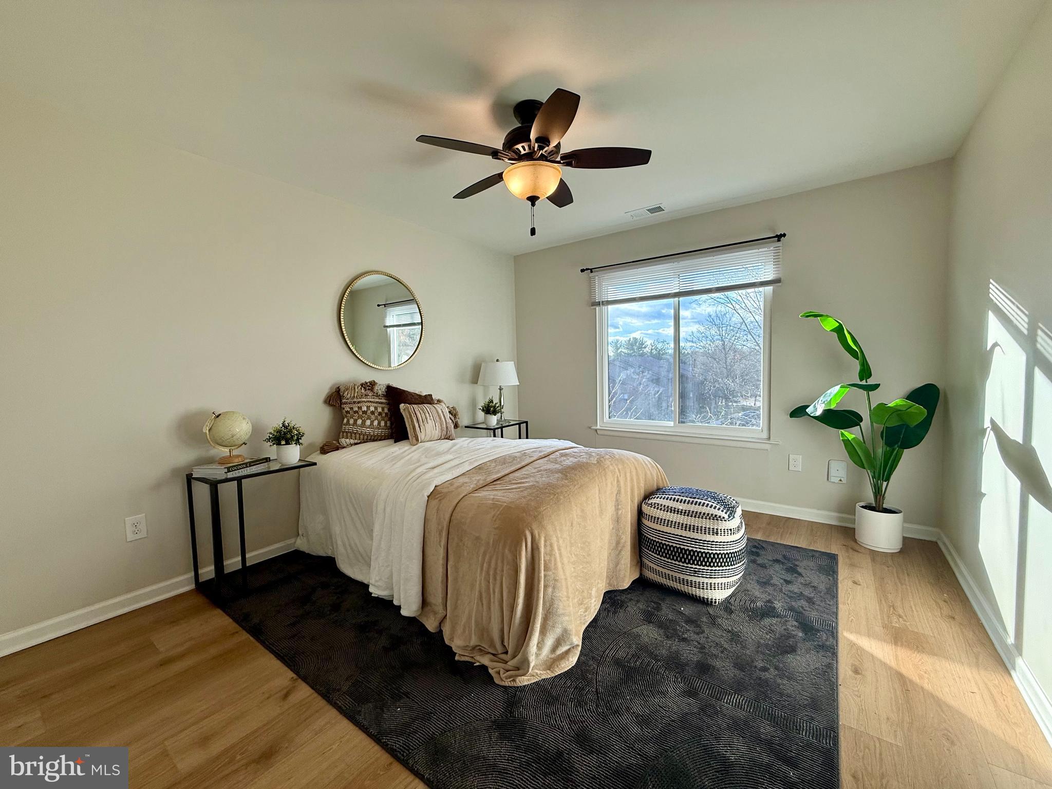 5355 Smooth Meadow Way, Unit 5 Columbia, MD 21044 - Photo 22 of 26 a bedroom with a bed and a window