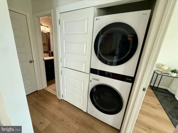 a view of a hallway with washer and dryer