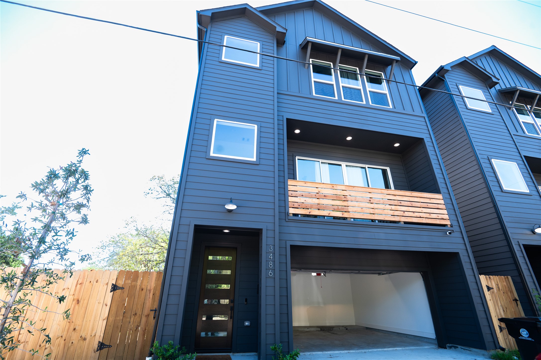 Modern farmhouse design viewed from the driveway.