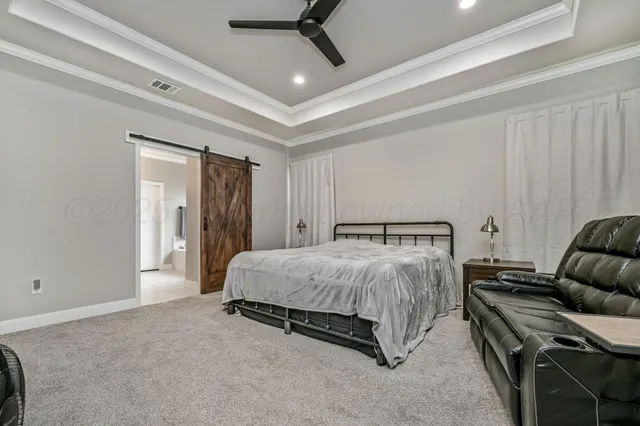 a spacious bathroom with a granite countertop sink and a mirror