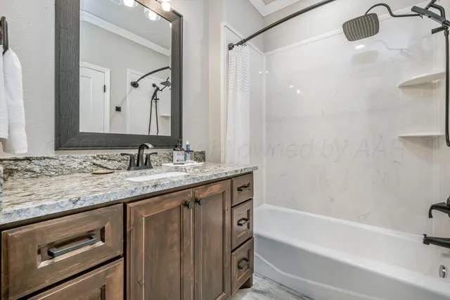 a utility room with sink dryer and washer