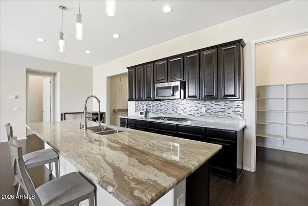 a bathroom with a double vanity sink and mirror