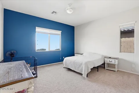 a bedroom with a bed and a closet