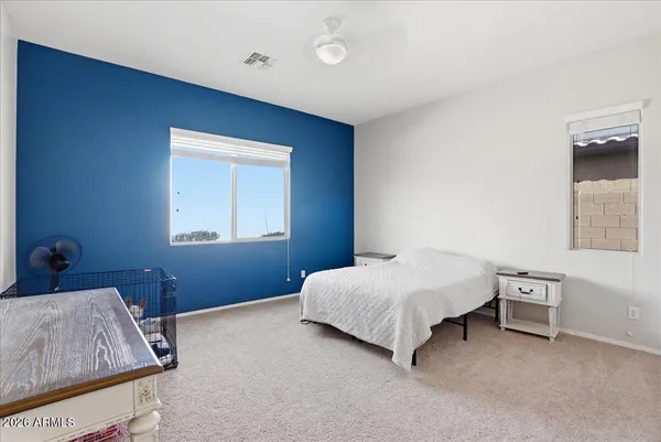 a bedroom with a bed and a closet