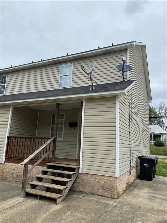 333 Forsyth Street, Unit A Barnesville, GA 30204 - Photo 2 of 5 a view of a patio with table and wooden floor