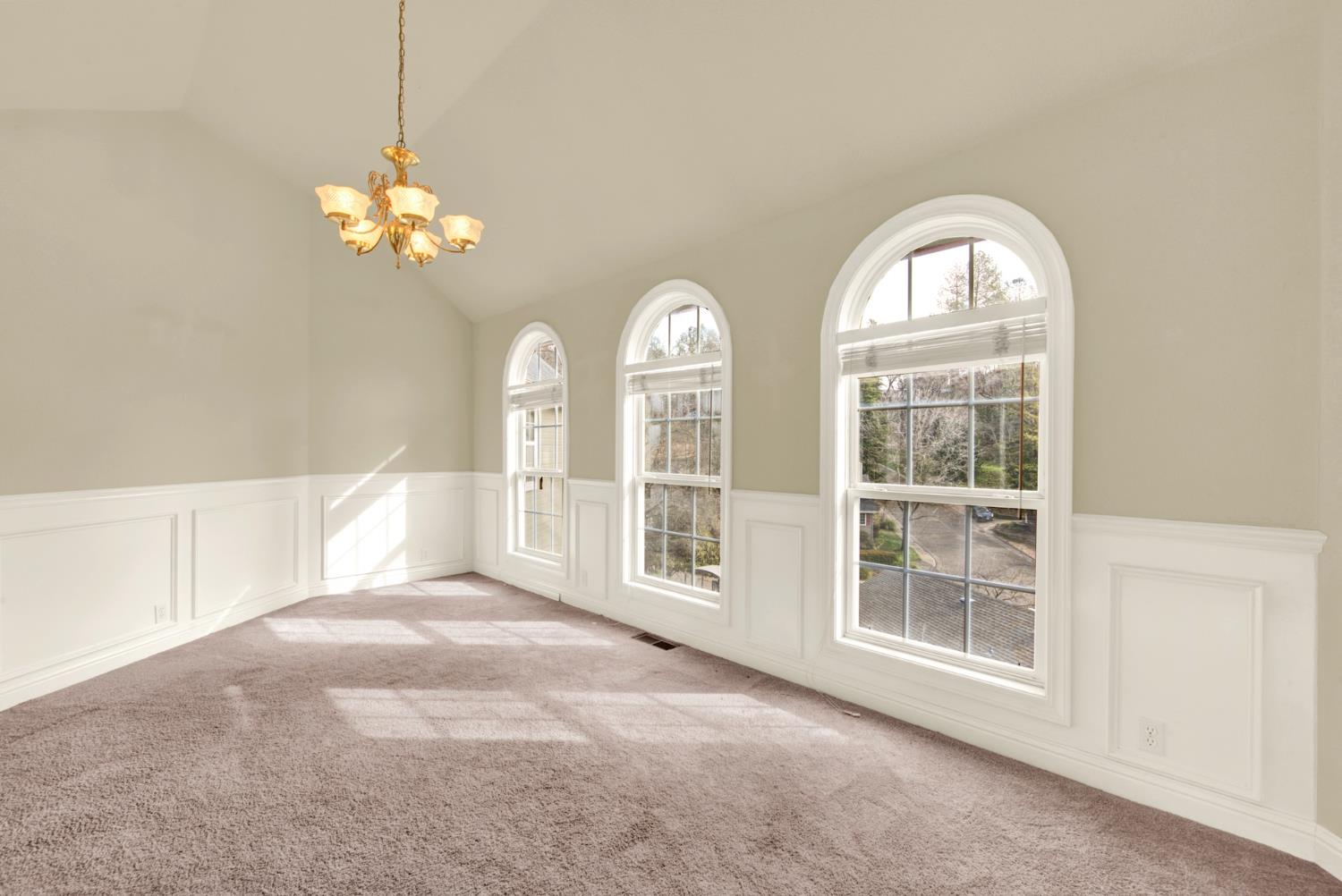 2812 Bronzecrest Street Placerville, CA 95667 - Photo 11 of 74 a view of a livingroom with a chandelier fan and windows