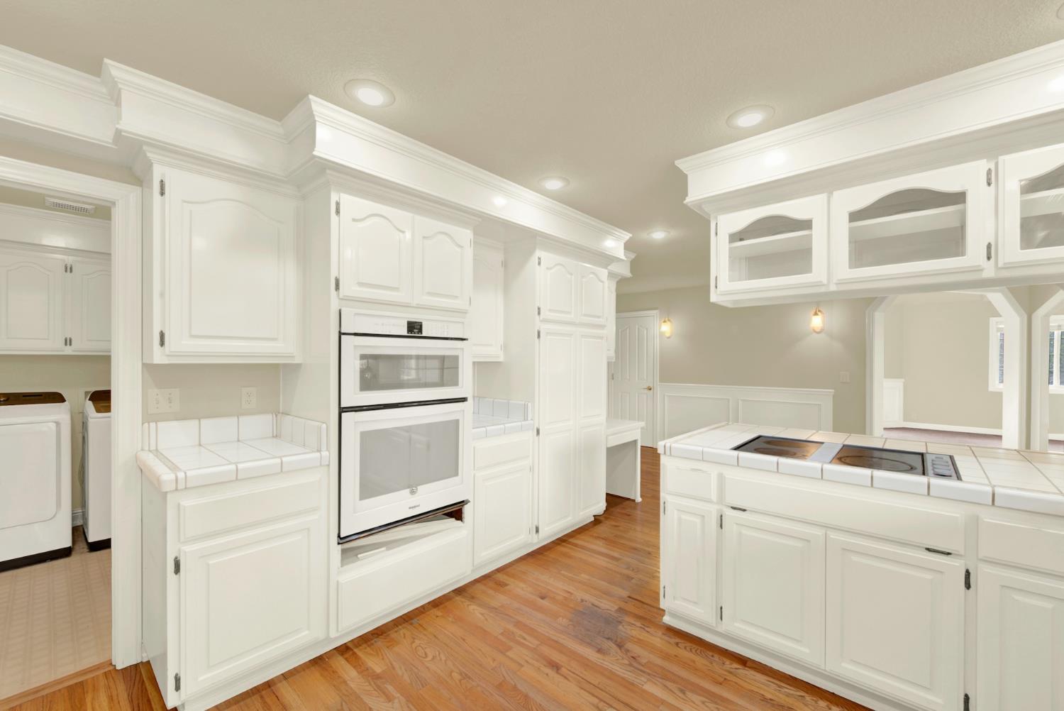 2812 Bronzecrest Street Placerville, CA 95667 - Photo 30 of 74 a kitchen with granite countertop white cabinets and stainless steel appliances