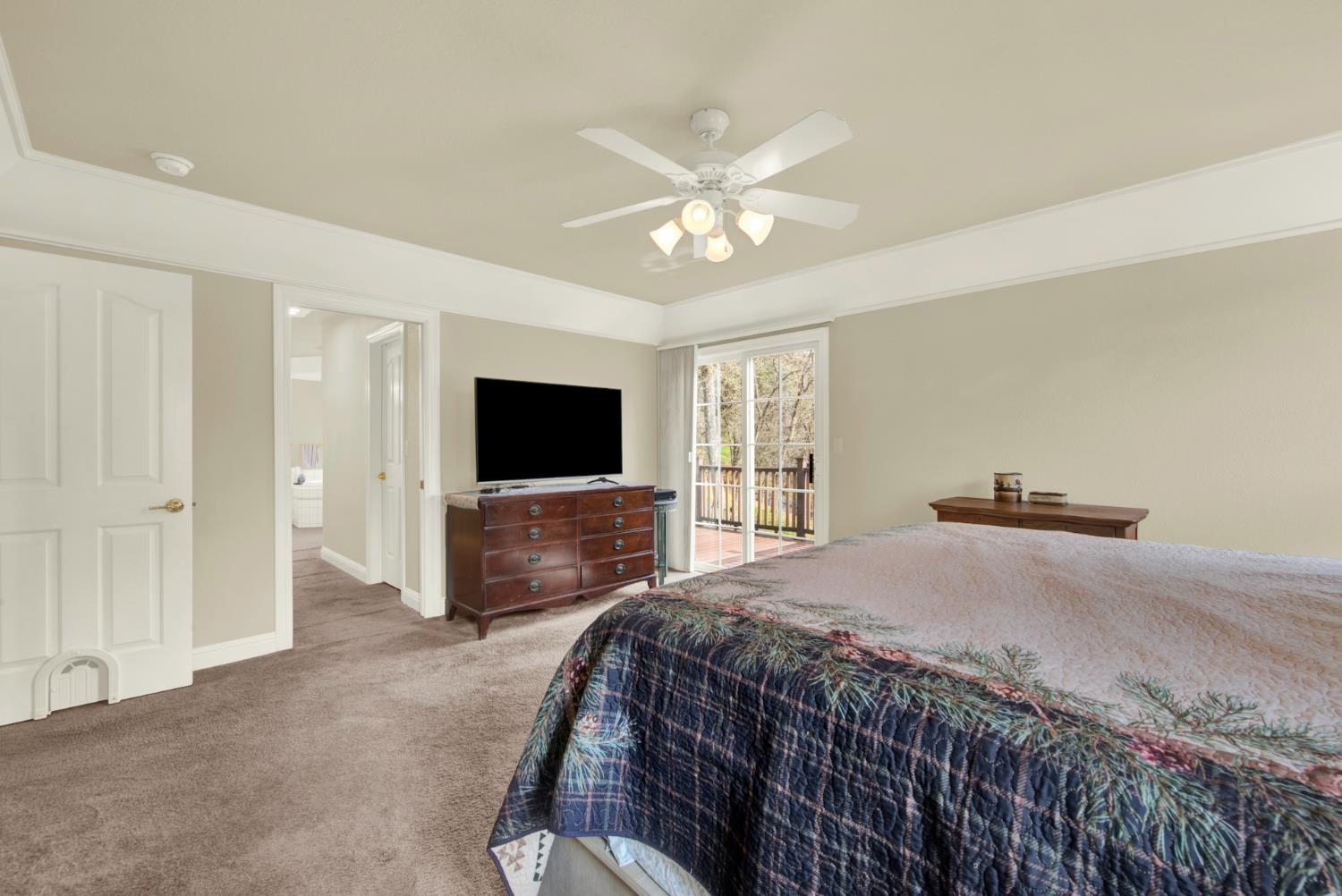 2812 Bronzecrest Street Placerville, CA 95667 - Photo 37 of 74 a bedroom with a bed and a flat screen tv