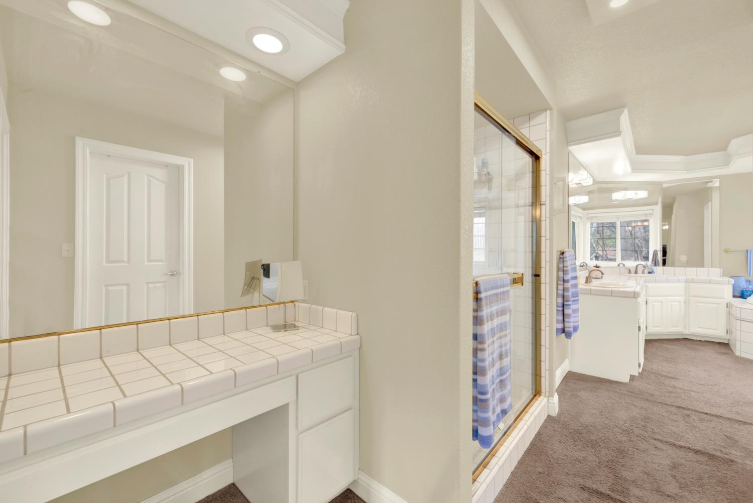 2812 Bronzecrest Street Placerville, CA 95667 - Photo 38 of 74 a bathroom with a sink a mirror and a shower