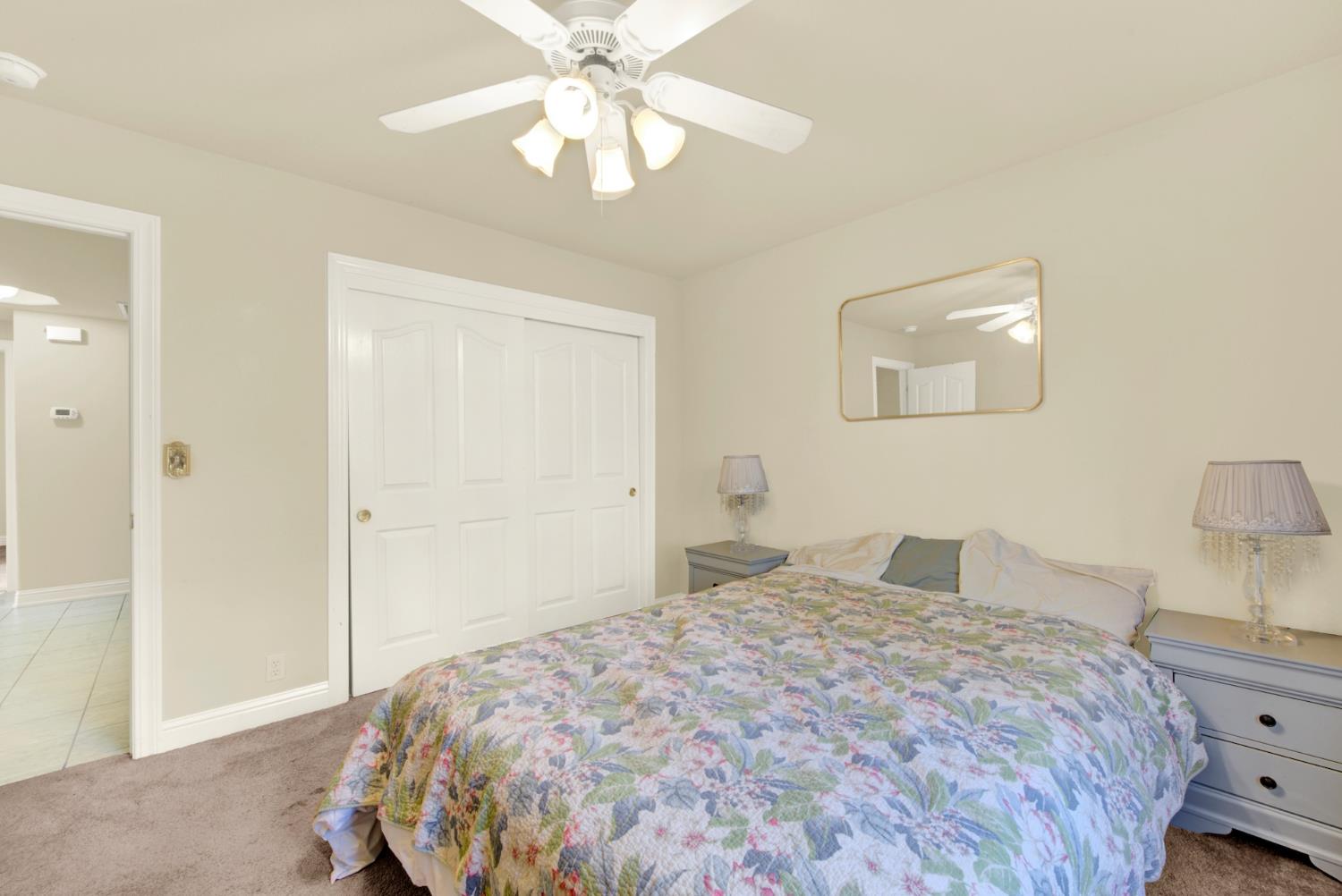 2812 Bronzecrest Street Placerville, CA 95667 - Photo 43 of 74 a bedroom with a bed and a chandelier