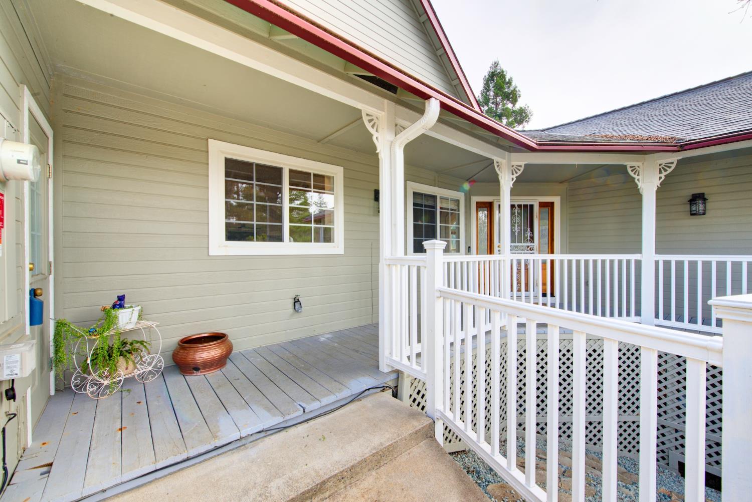 2812 Bronzecrest Street Placerville, CA 95667 - Photo 5 of 74 a view of a house with a wooden bench