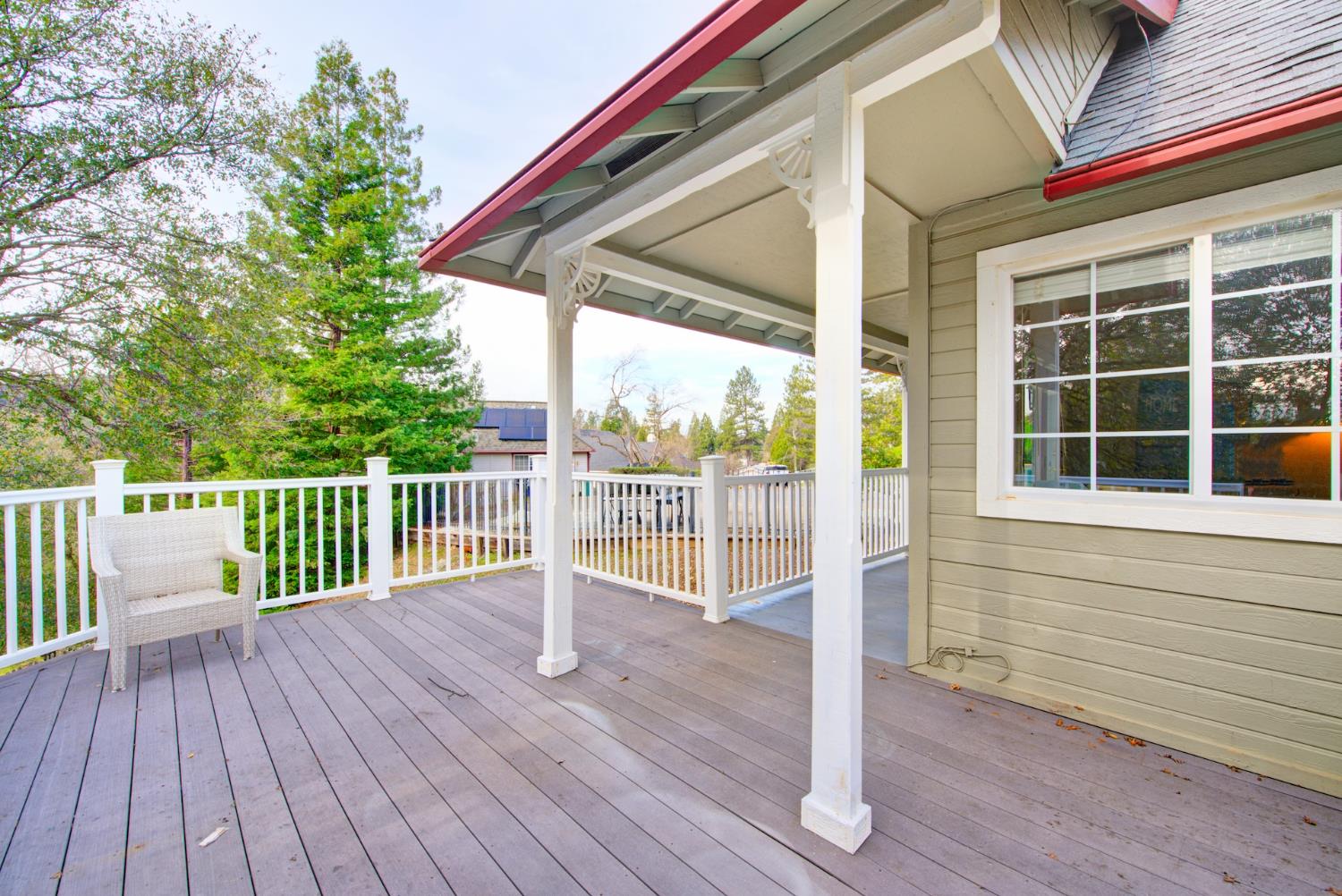 2812 Bronzecrest Street Placerville, CA 95667 - Photo 53 of 74 a view of a deck with wooden floor and fence with a floor to ceiling window