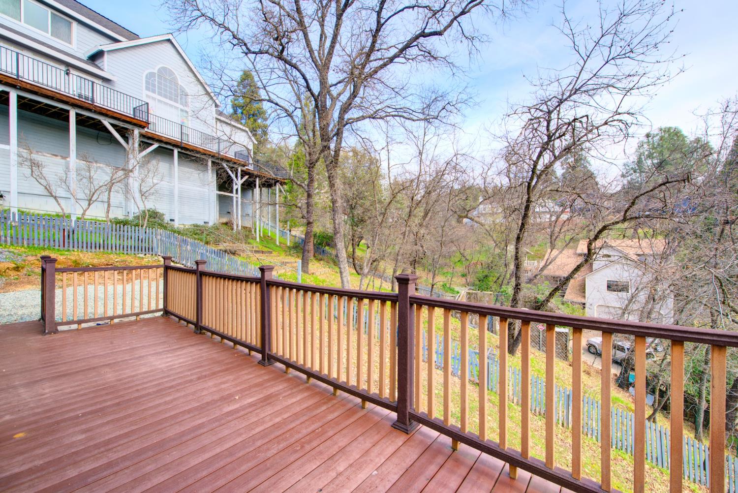 2812 Bronzecrest Street Placerville, CA 95667 - Photo 59 of 74 a view of a house with wooden deck next to a yard