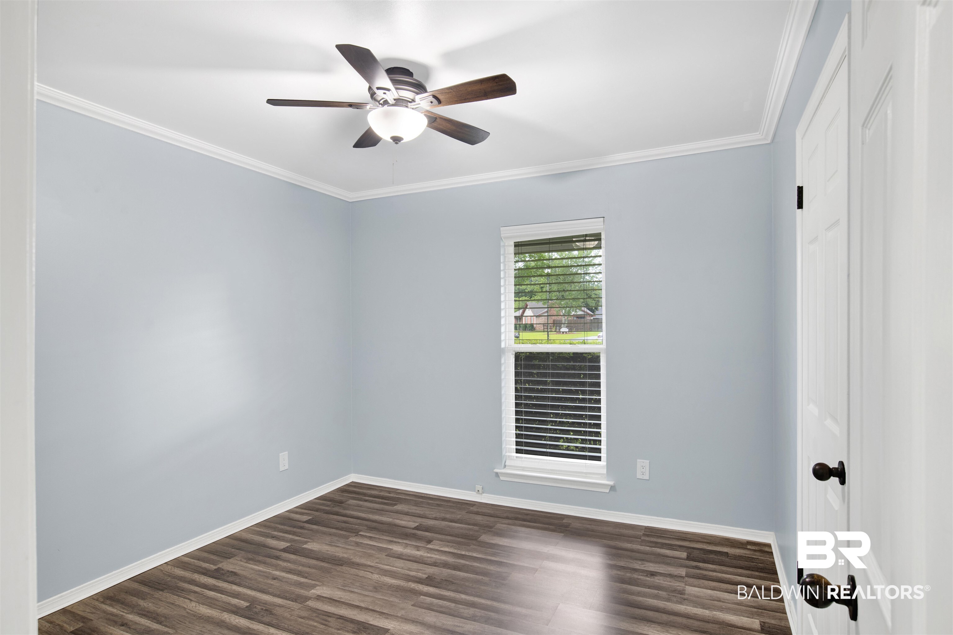 3011 Olde Gate Road Mobile, AL 36695 - Photo 21 of 35 Unfurnished room with a ceiling fan, dark wood-style floors, and crown molding