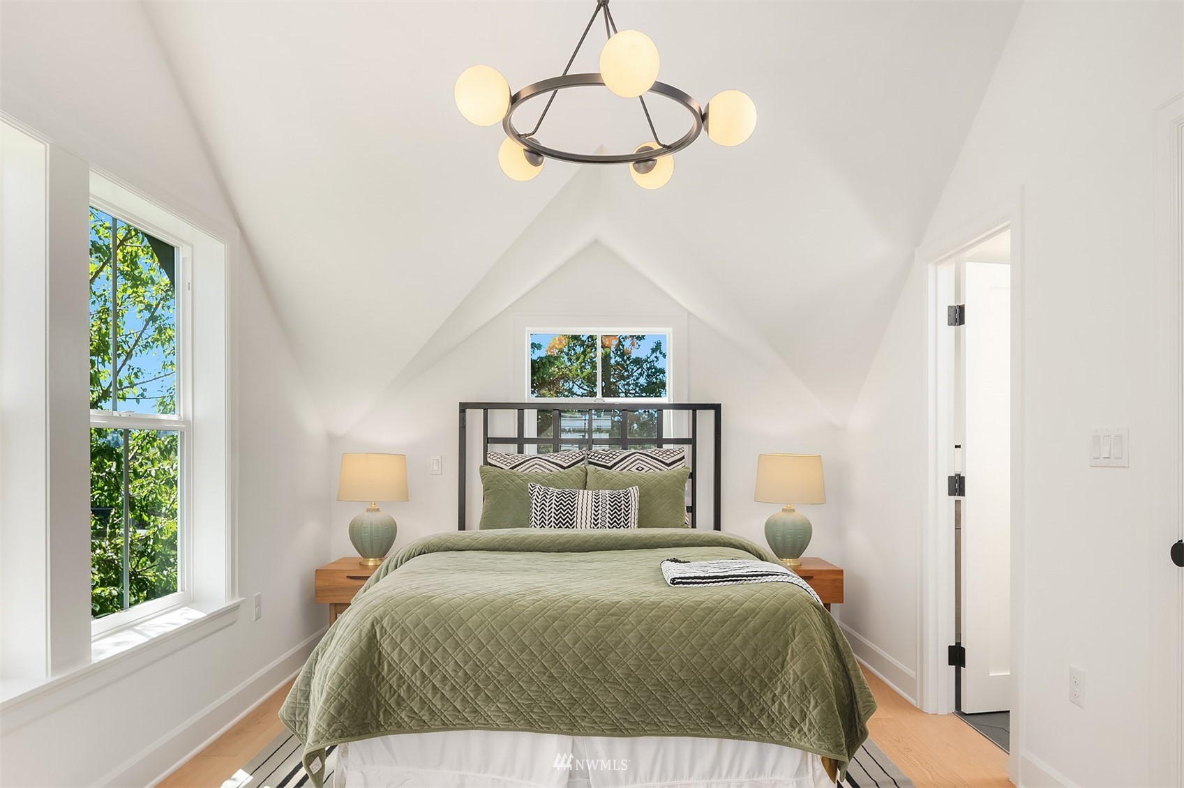 8041 Stroud Avenue North, Unit B Seattle, WA 98103 - Photo 15 of 29 a bedroom with a bed and a window