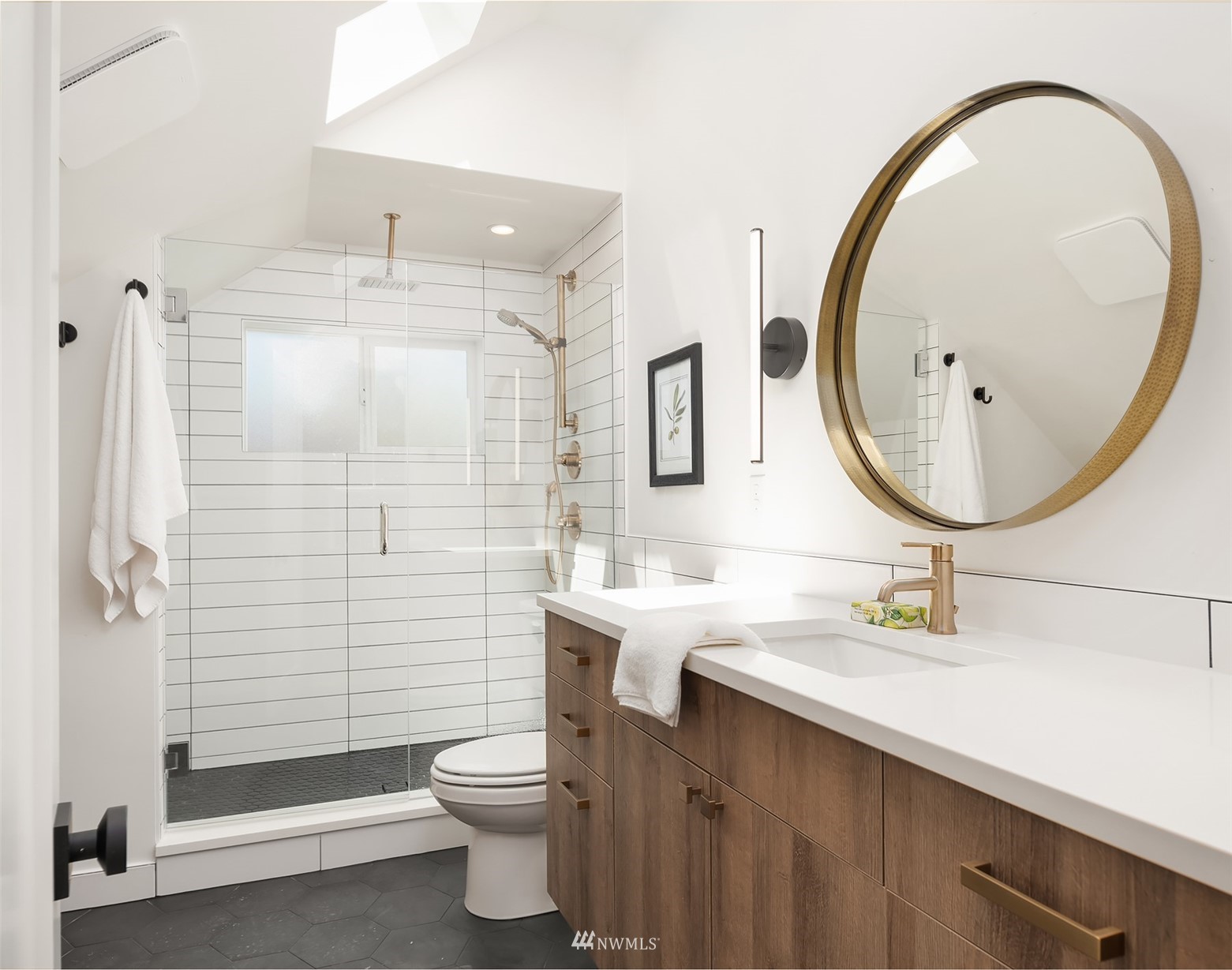 8041 Stroud Avenue North, Unit B Seattle, WA 98103 - Photo 18 of 29 a bathroom with a sink mirror toilet and shower