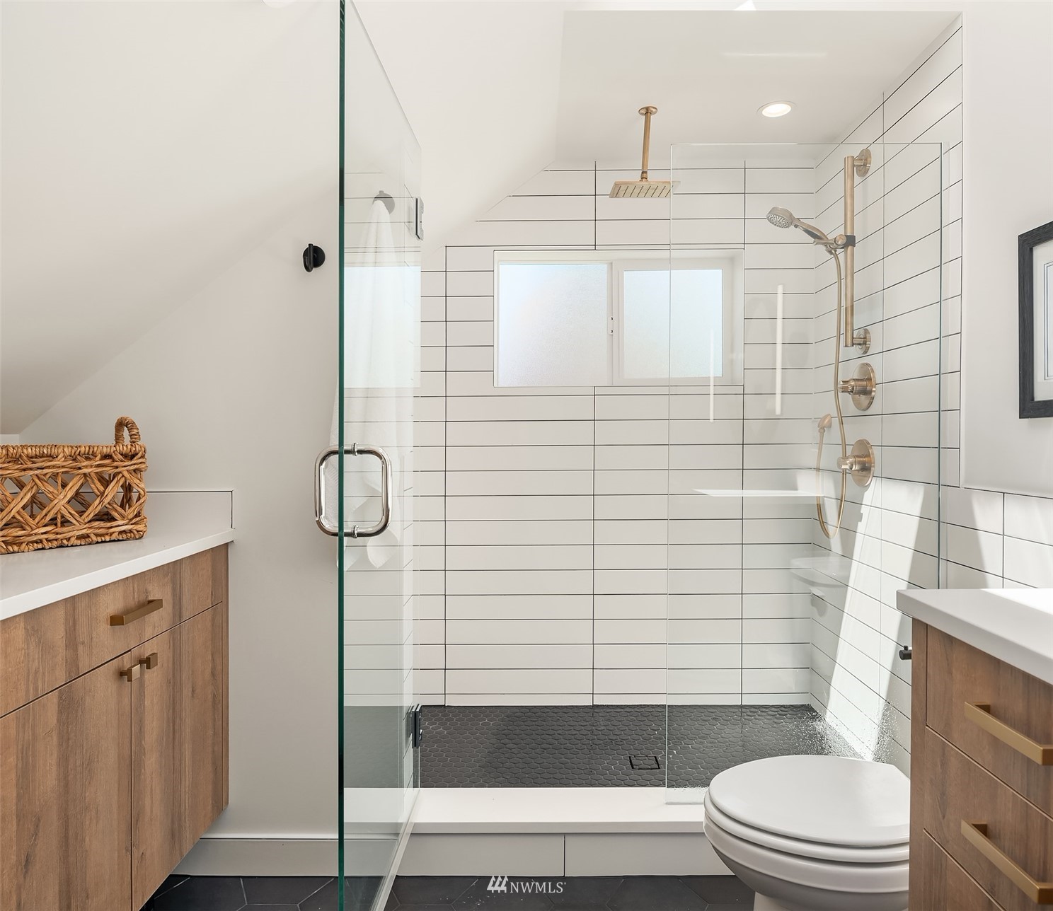 8041 Stroud Avenue North, Unit B Seattle, WA 98103 - Photo 19 of 29 a bathroom with a toilet and shower