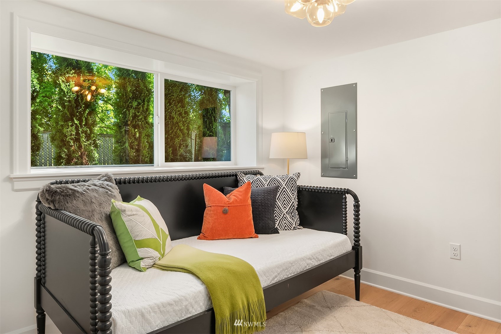 8041 Stroud Avenue North, Unit B Seattle, WA 98103 - Photo 20 of 29 a bedroom with a bed and a window