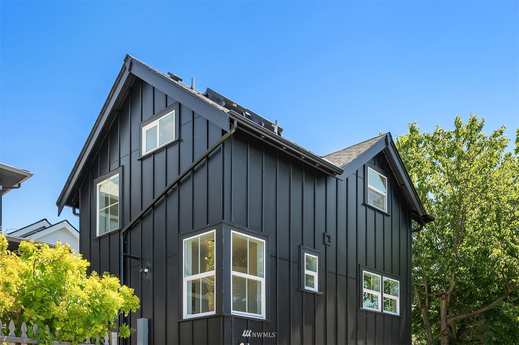 8041 Stroud Avenue North, Unit B Seattle, WA 98103 - Photo 26 of 29 a front view of a house with plants