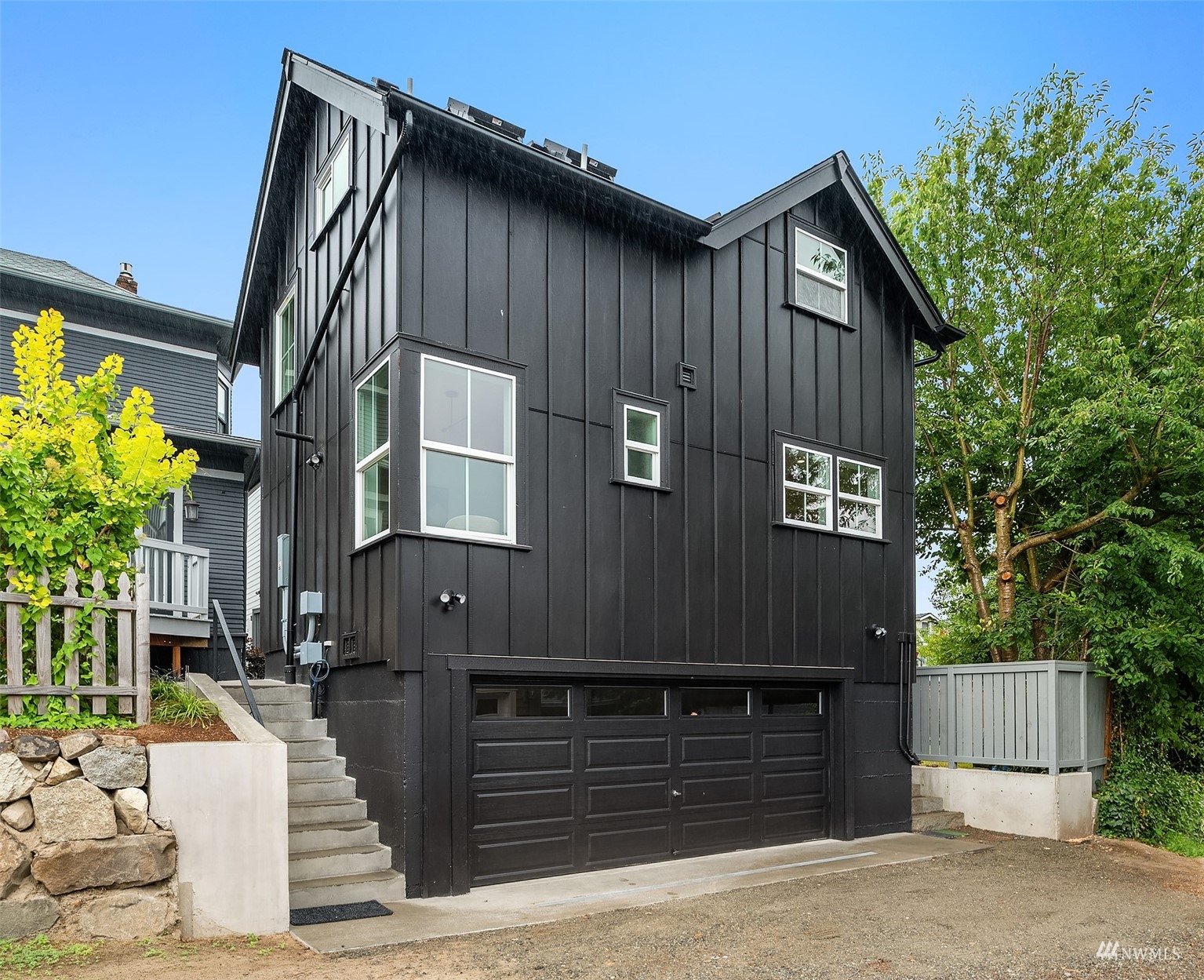 8041 Stroud Avenue North, Unit B Seattle, WA 98103 - Photo 28 of 29 a front view of a house with a garden