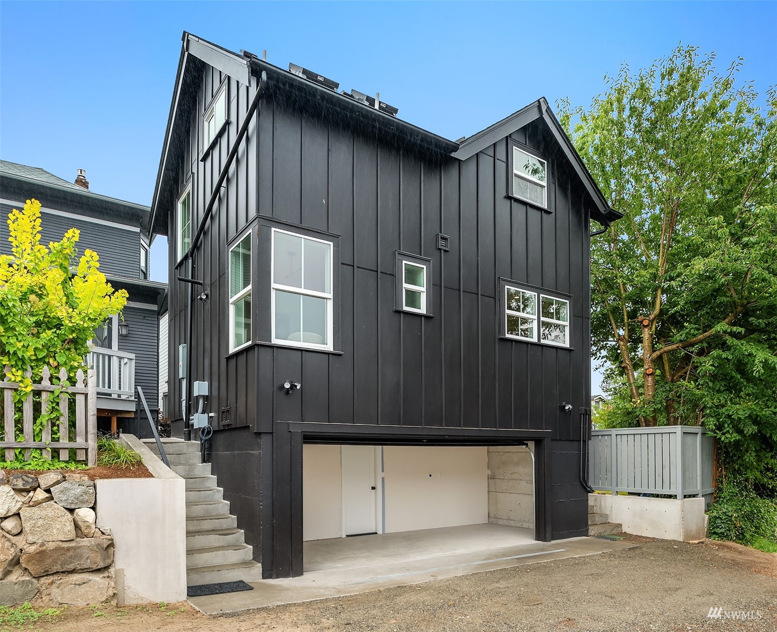 8041 Stroud Avenue North, Unit B Seattle, WA 98103 - Photo 29 of 29 a front view of a house with a garage