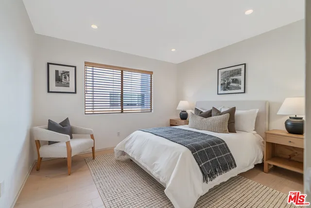 a living room with furniture and a lamp