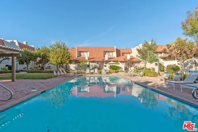 swimming pool view with a outdoor space