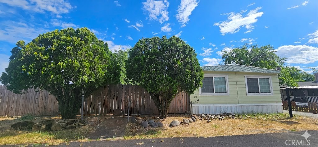 2920 Clark Road, Unit C12 Oroville, CA 95965 - Photo 2 of 17 a front view of a house with garden