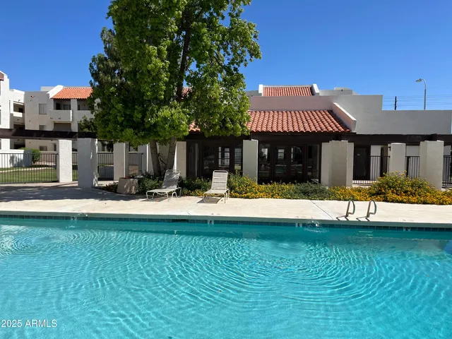 a view of a house with swimming pool