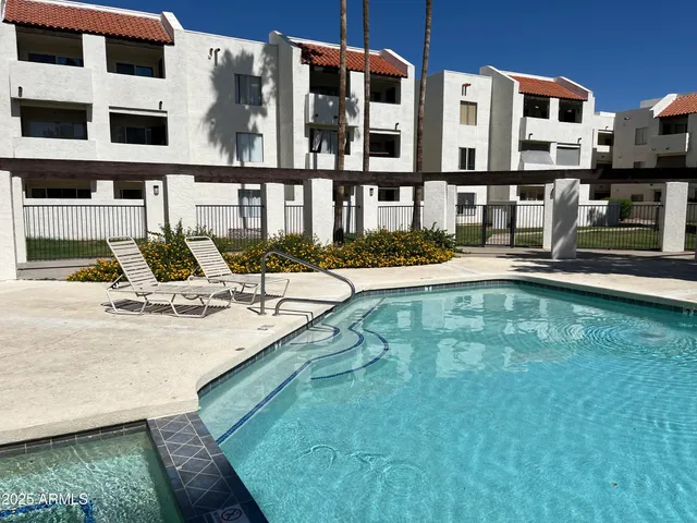 a view of a patio with swimming pool