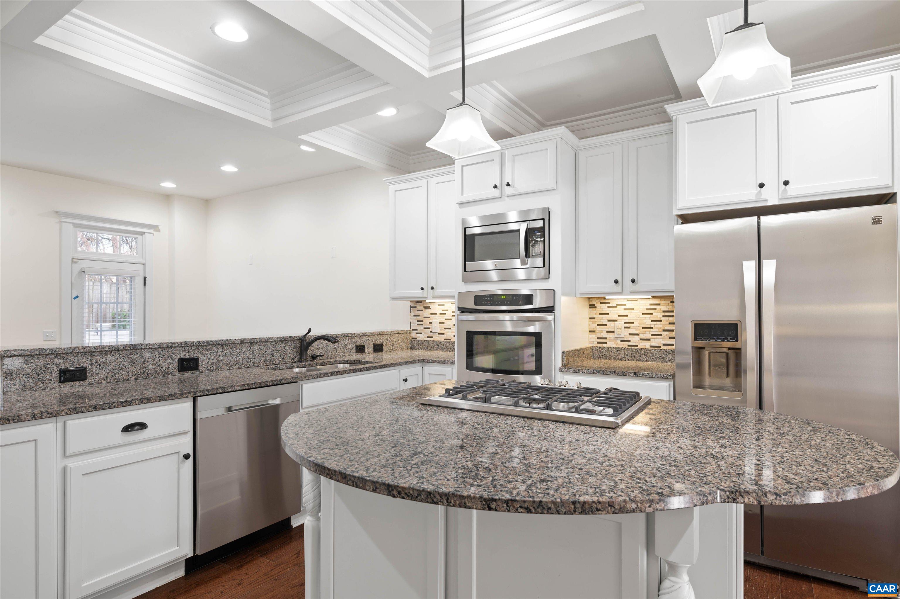 2054 Avinity Loop Charlottesville, VA 22902 - Photo 12 of 62 a kitchen with kitchen island granite countertop a sink counter space cabinets and stainless steel appliances
