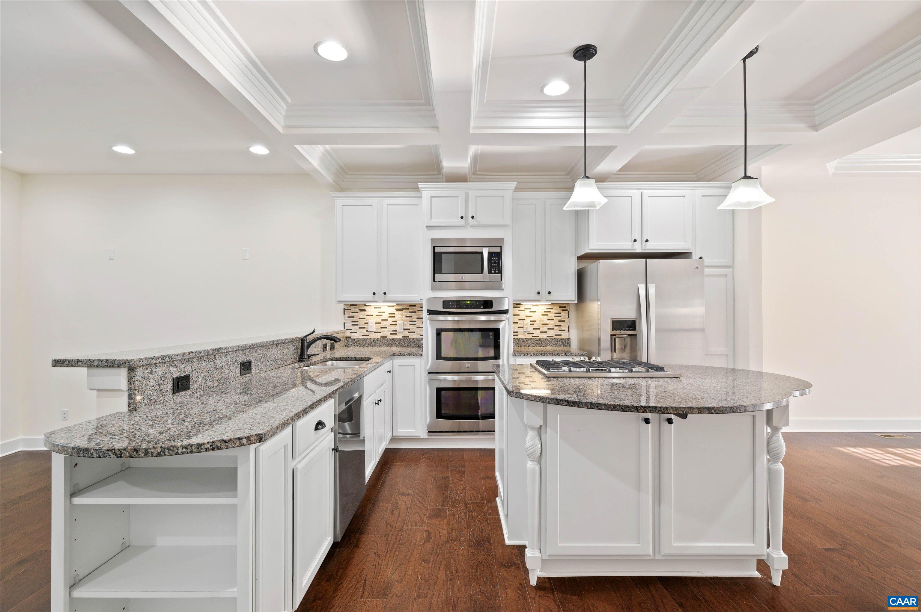 2054 Avinity Loop Charlottesville, VA 22902 - Photo 13 of 62 a kitchen with stainless steel appliances granite countertop a stove a sink and a wooden floor