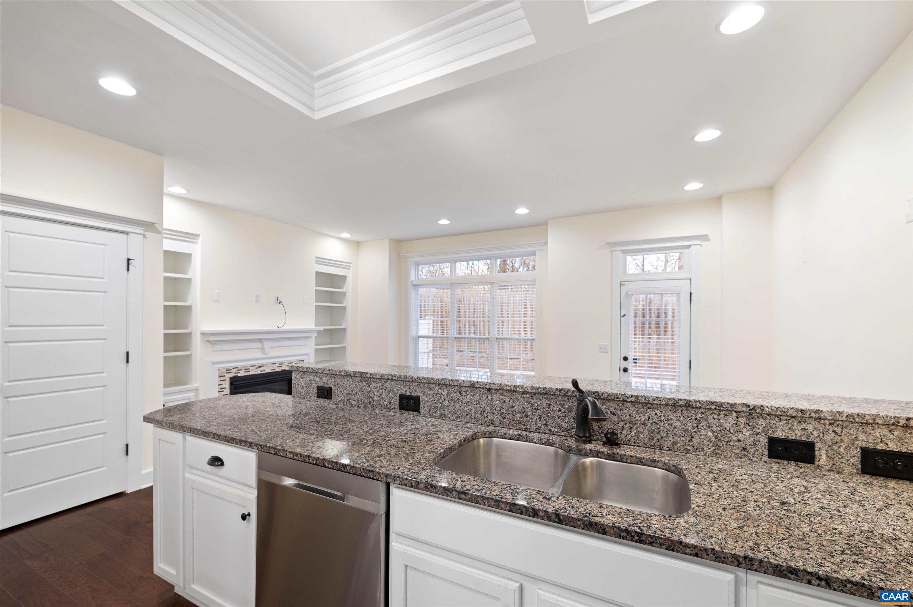 2054 Avinity Loop Charlottesville, VA 22902 - Photo 18 of 62 a kitchen with granite countertop a sink and a window