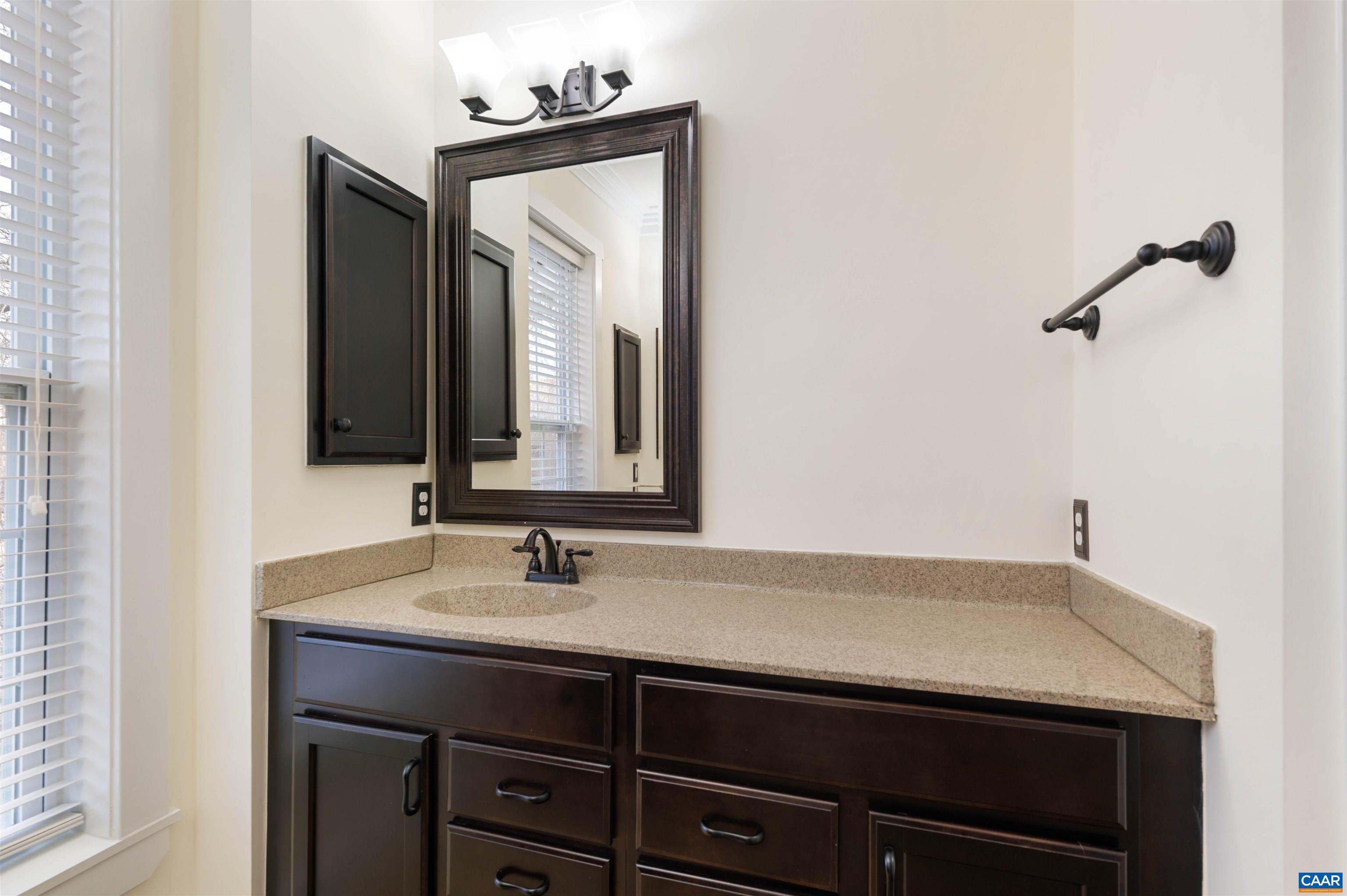2054 Avinity Loop Charlottesville, VA 22902 - Photo 29 of 62 a bathroom with a sink and a mirror