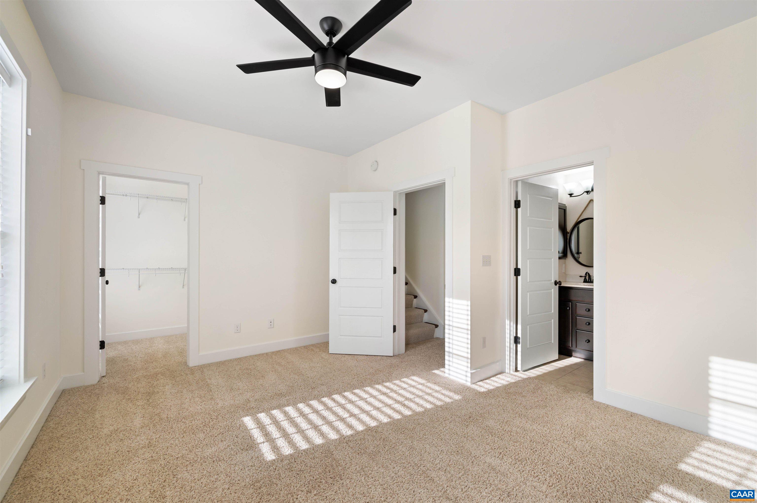 2054 Avinity Loop Charlottesville, VA 22902 - Photo 34 of 62 an empty room with closet and a ceiling fan