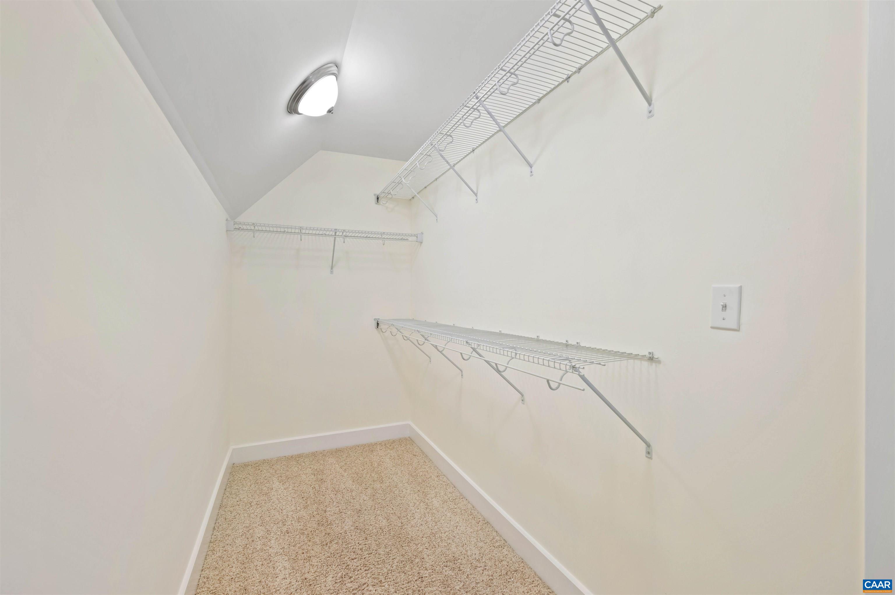 2054 Avinity Loop Charlottesville, VA 22902 - Photo 43 of 62 a view of a room with racks on the wall