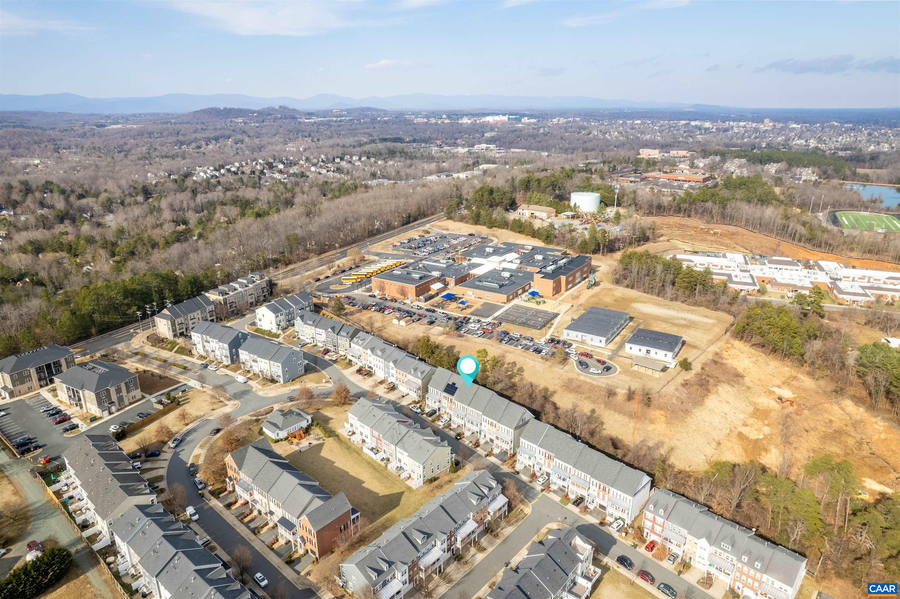 2054 Avinity Loop Charlottesville, VA 22902 - Photo 60 of 62 an aerial view of residential building with parking space