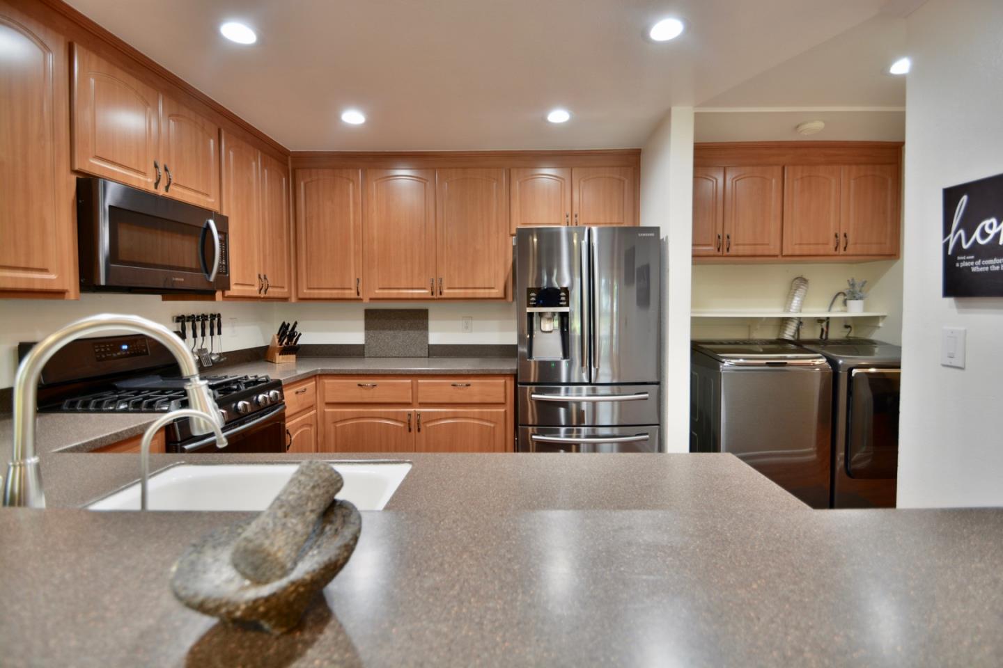 2298 Almaden Road, Unit A San Jose, CA 95125 - Photo 16 of 43 a kitchen with stainless steel appliances granite countertop a refrigerator and a stove top oven with wooden floor