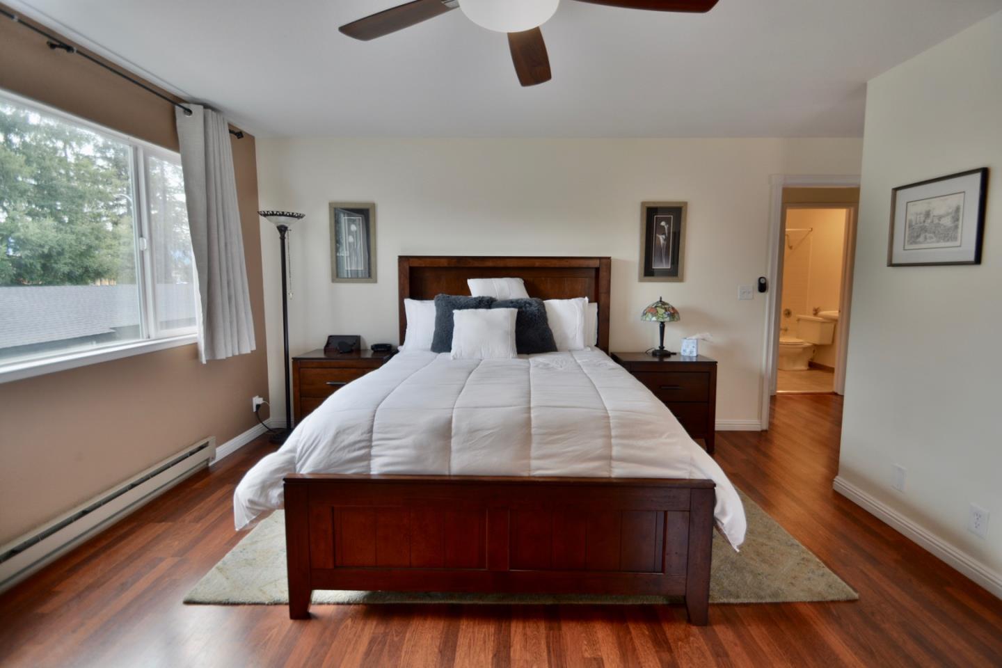 2298 Almaden Road, Unit A San Jose, CA 95125 - Photo 29 of 43 a large bed sitting in a bedroom next to a window