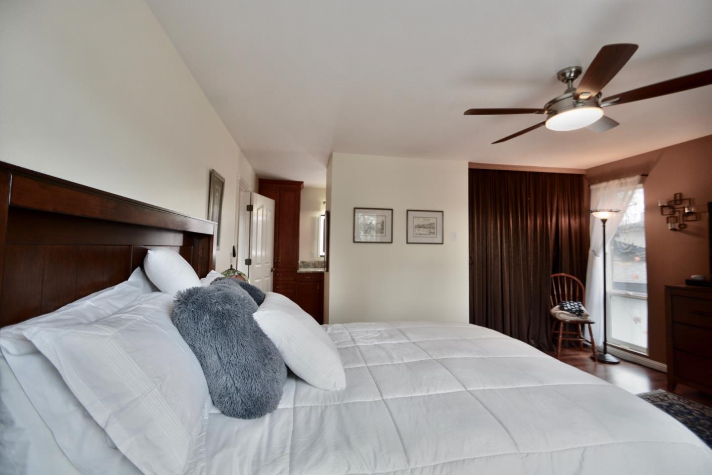 2298 Almaden Road, Unit A San Jose, CA 95125 - Photo 31 of 43 a bedroom with a large bed and a chandelier