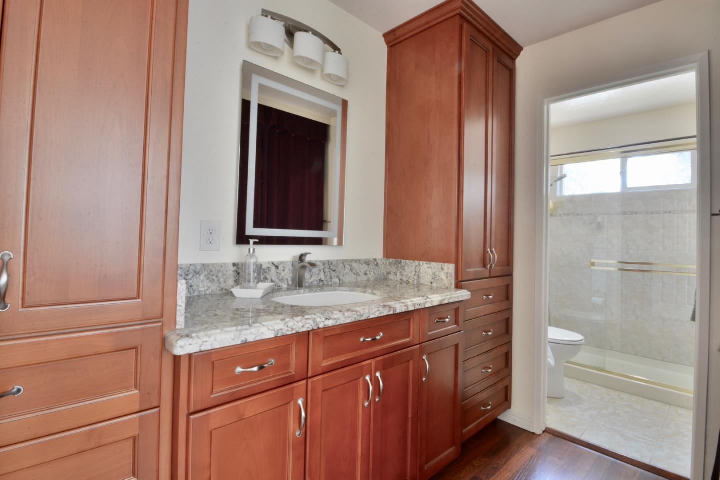 2298 Almaden Road, Unit A San Jose, CA 95125 - Photo 34 of 43 a bathroom with a granite countertop sink and a mirror