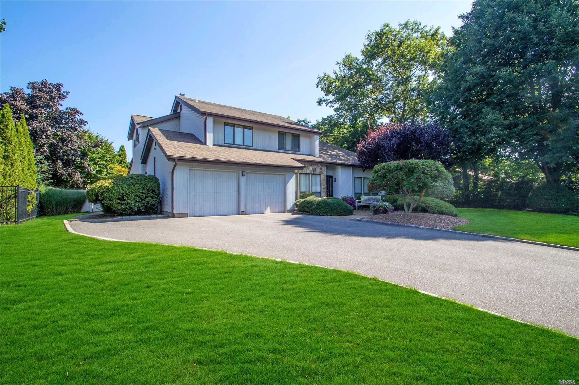8 Barbera Road Commack, NY 11725 - Photo 1 of 1 a front view of a house with a yard