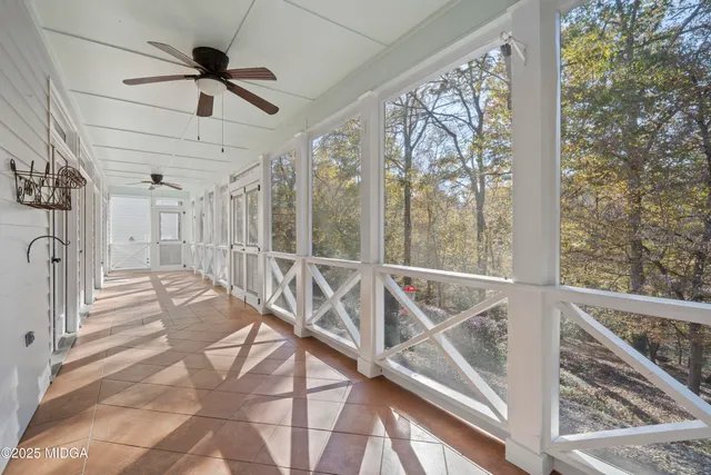 a view of a house with swimming pool and sitting area